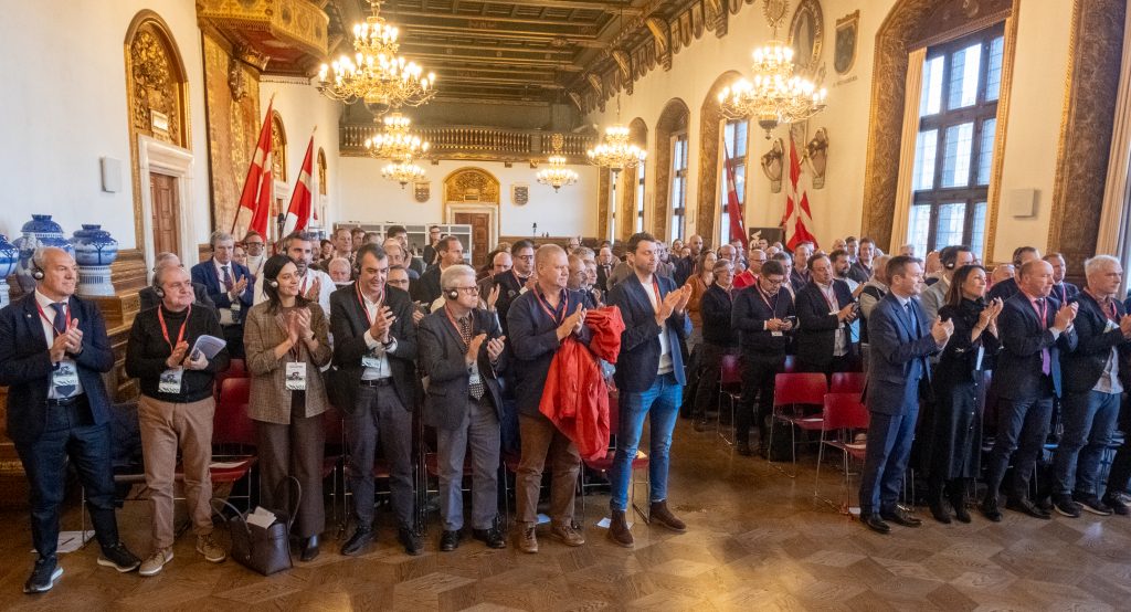 Delegates at the AIOCC Conference clapping a presentation