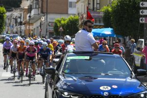 Pau Cuevas Roura in Race Organisers lead car followed by the Peloton